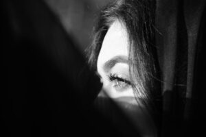 woman looking out of window
